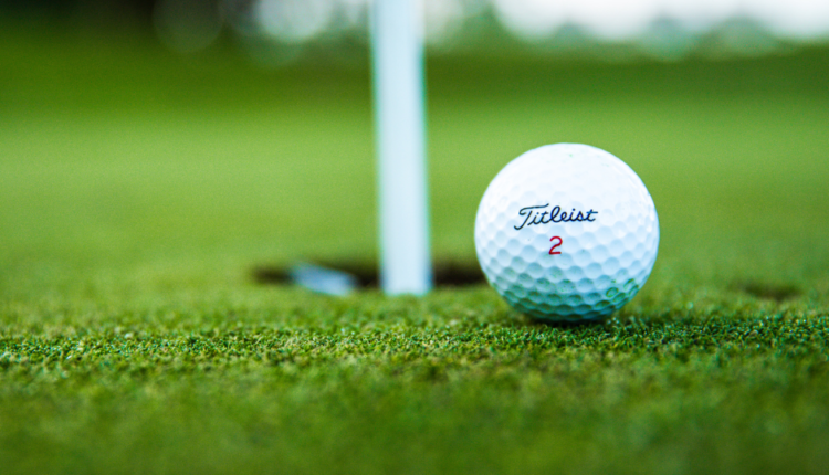 ball rolling into hole